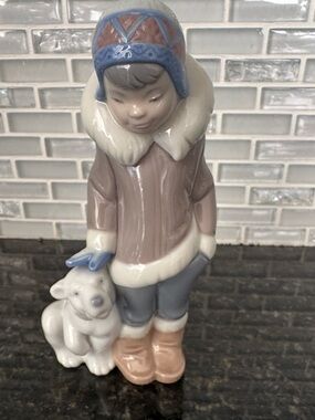Lladró porcelain figurine titled "Eskimo Boy with Pet" (Model #5238) Vintage